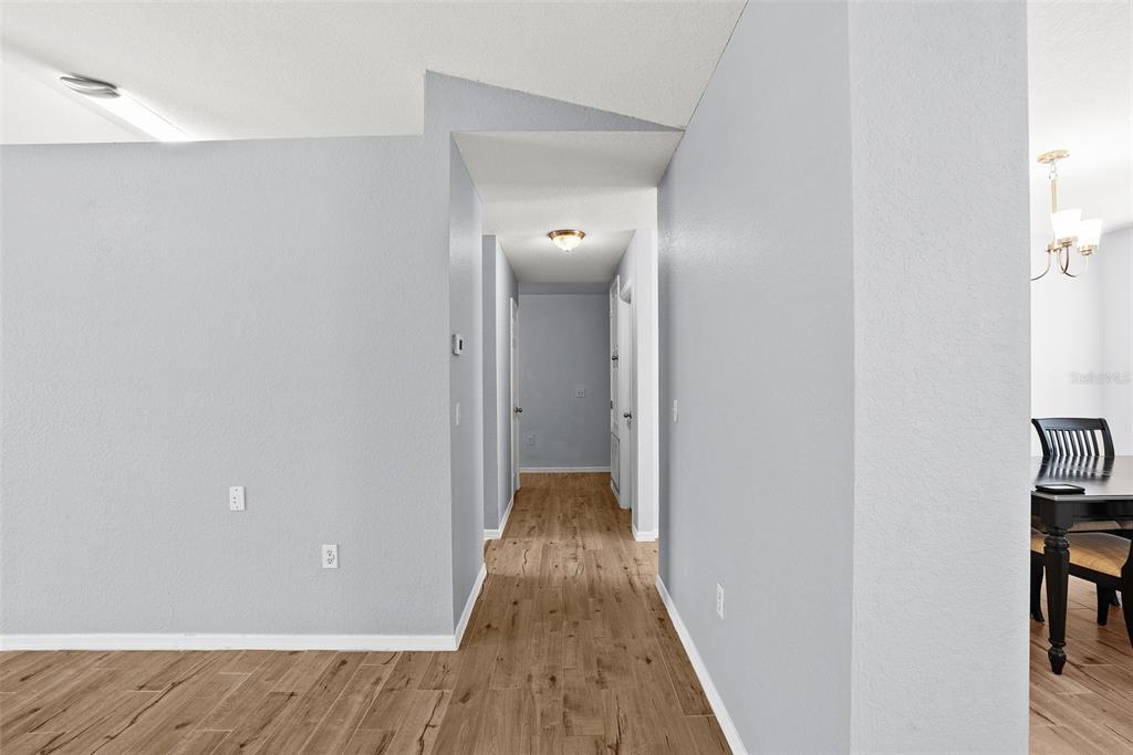 11366 Riddle Drive Spring Hill, FL 34609 - Photo 20 of 49 a view of a hallway with wooden floor and closet