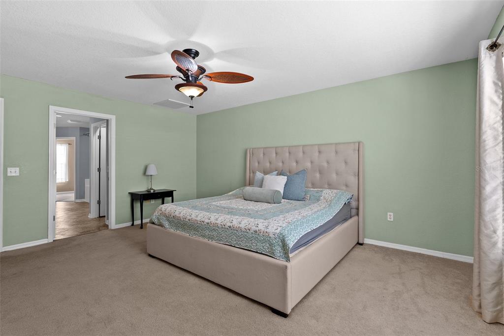 11366 Riddle Drive Spring Hill, FL 34609 - Photo 23 of 49 a bedroom with a bed and window