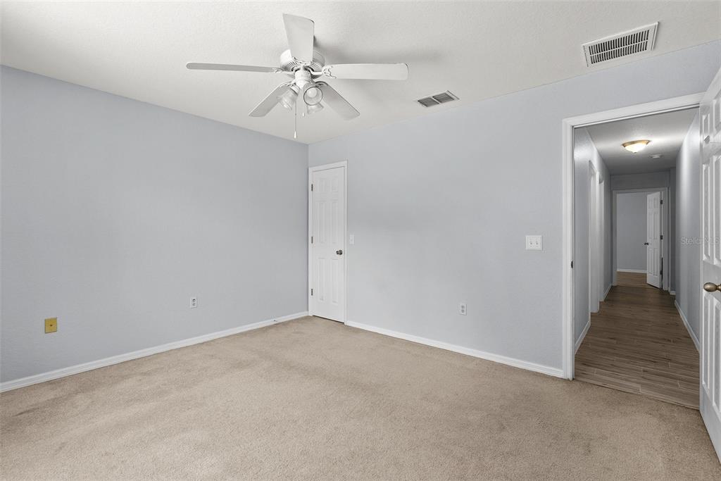 11366 Riddle Drive Spring Hill, FL 34609 - Photo 34 of 49 wooden floor in an empty room