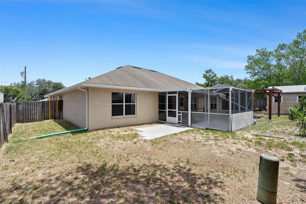 11366 Riddle Drive Spring Hill, FL 34609 - Photo 44 of 49 a house with yard in front of it