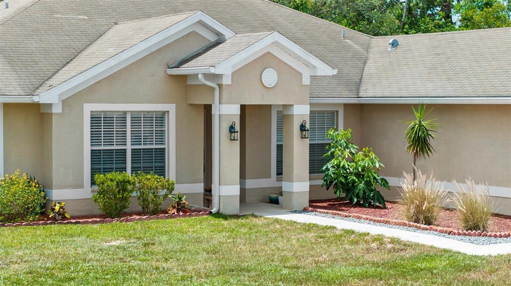 11366 Riddle Drive Spring Hill, FL 34609 - Photo 45 of 49 a front view of a house with a yard