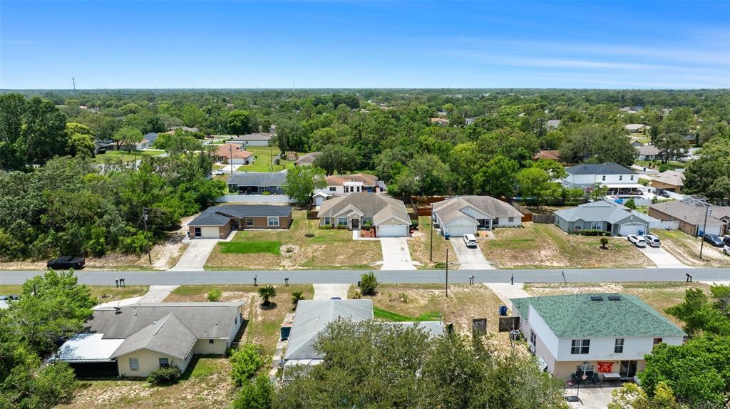 11366 Riddle Drive Spring Hill, FL 34609 - Photo 48 of 49 an aerial view of residential houses with outdoor space and street view