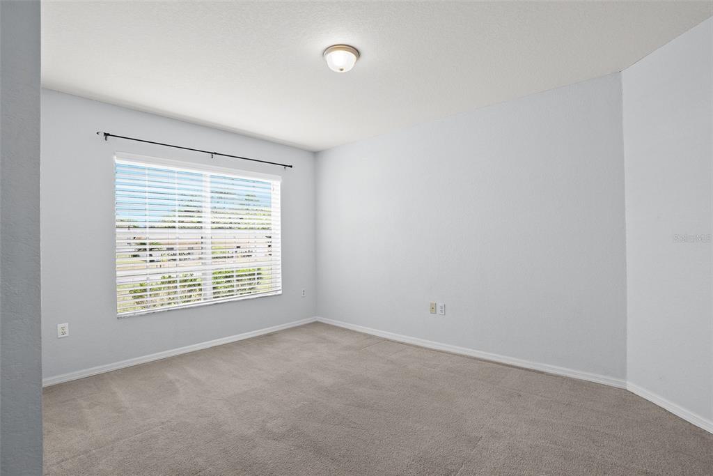 11366 Riddle Drive Spring Hill, FL 34609 - Photo 7 of 49 a view of an empty room with a window