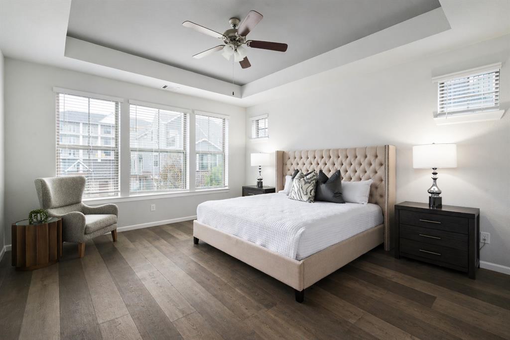 1115 Manacor Lane Dallas, TX 75212 - Photo 20 of 28 a bedroom with a bed and a chair