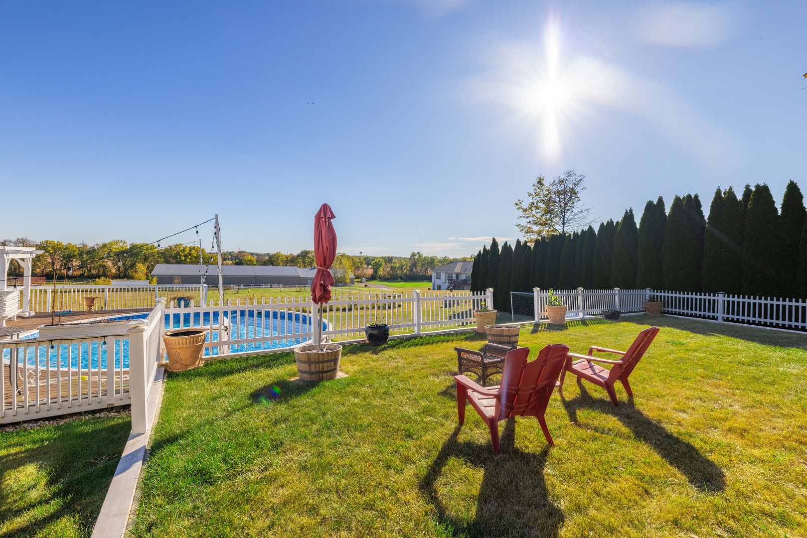 6338 Thicket Lane Cherry Valley, IL 61016 - Photo 36 of 43 a view of a swimming pool with lawn chairs and a yard
