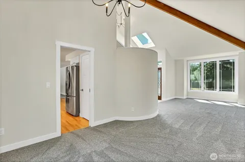 a kitchen with a sink stove and refrigerator