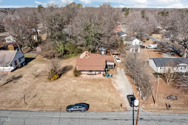 an aerial view of residential houses with outdoor space