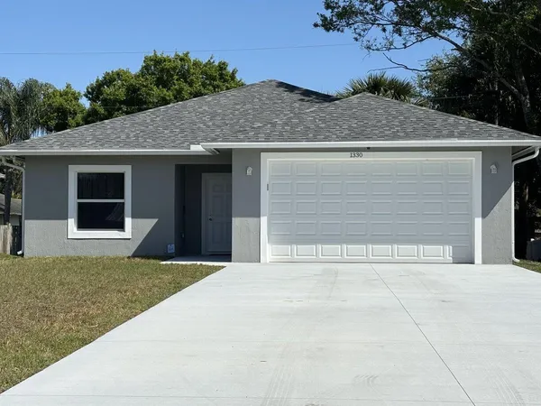 a house with yard in front of it