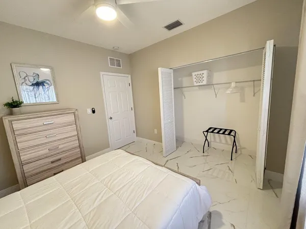 a bedroom with a bed and a table
