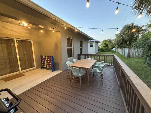 a view of a patio with a table and chairs