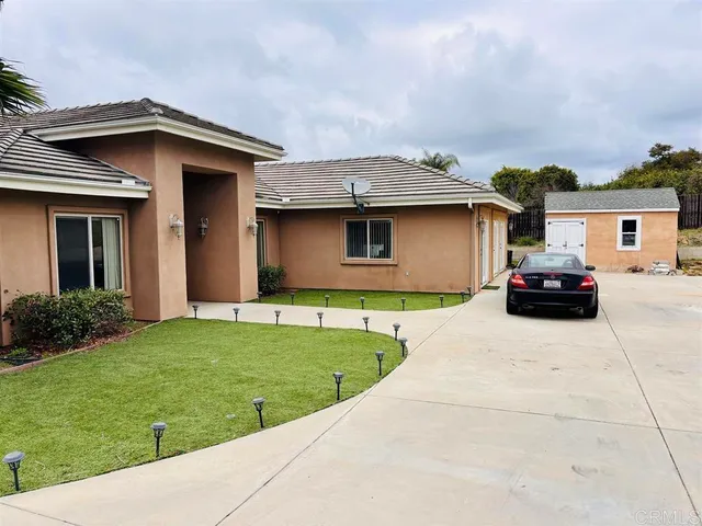 a house view with a garden space