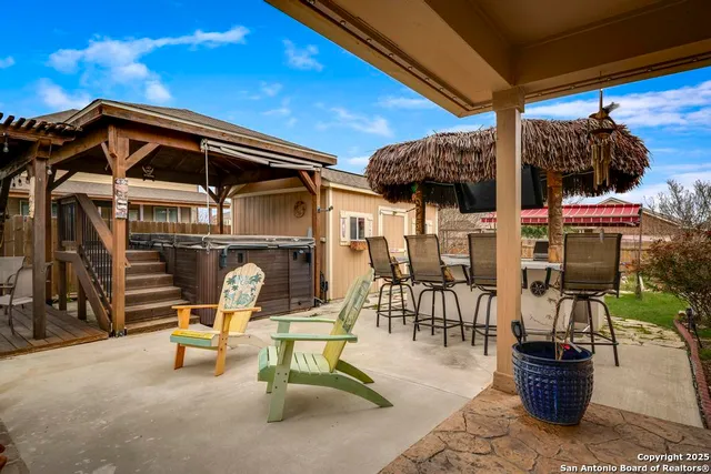a view of a chairs and tables in the patio