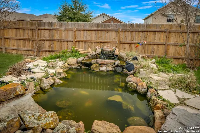 a view of swimming pool with outdoor seating