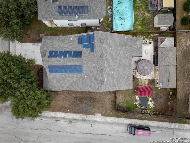 an aerial view of residential houses with outdoor space