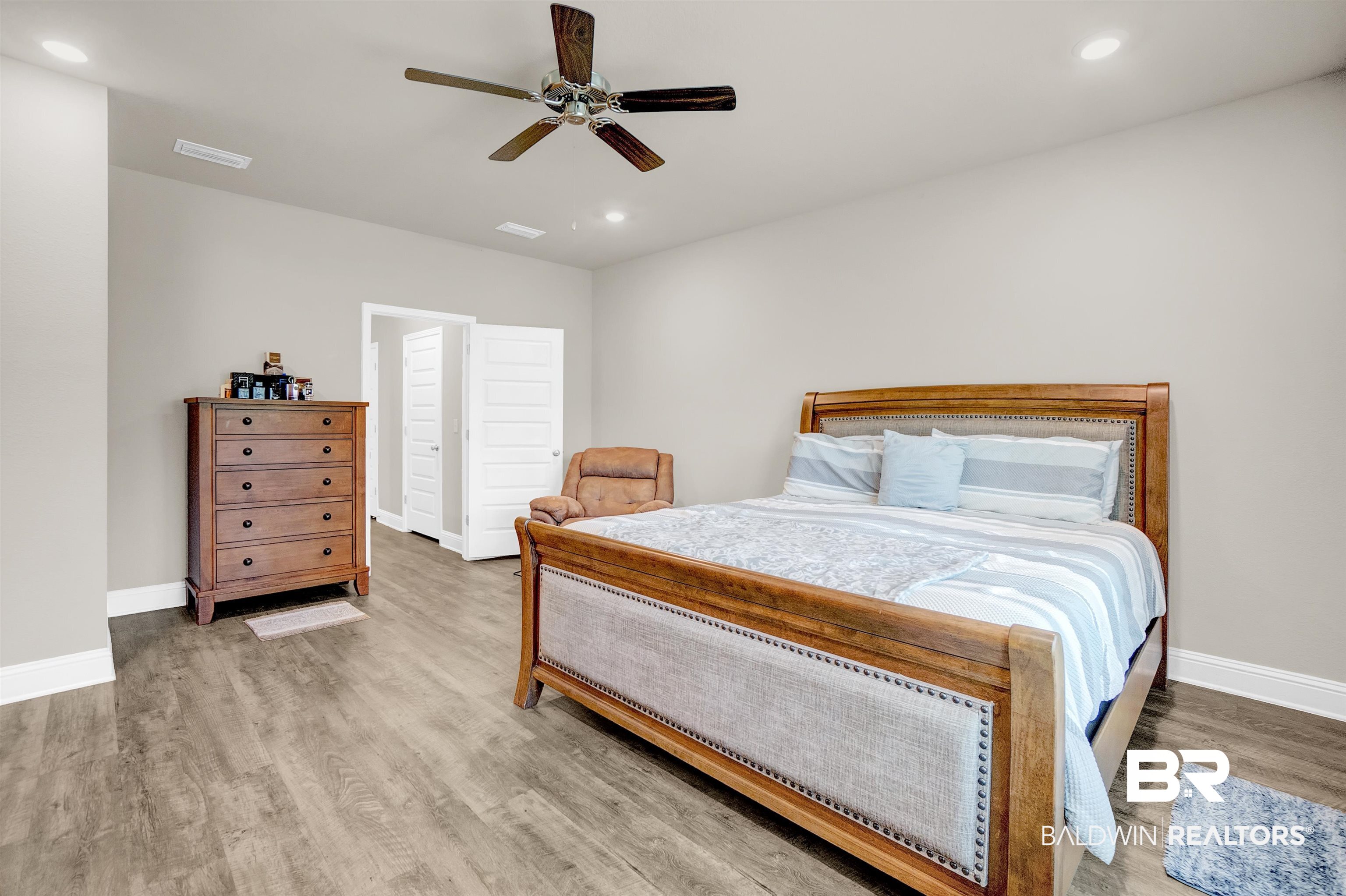 31671 Memphis Loop Daphne, AL 36527 - Photo 26 of 51 Bedroom with baseboards, wood finished floors, recessed lighting, and a ceiling fan