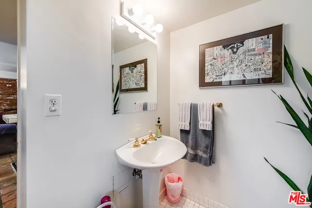 a spacious bedroom with a bed and glass window