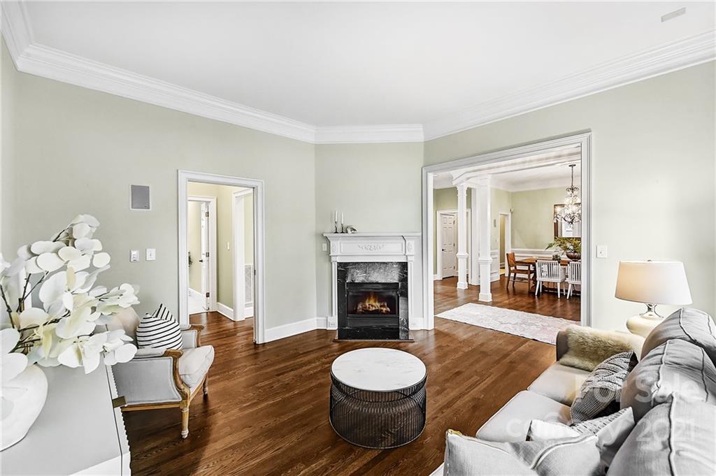 2826 Sharon Road Charlotte, NC 28211 - Photo 14 of 47 a living room with furniture a fireplace and a table