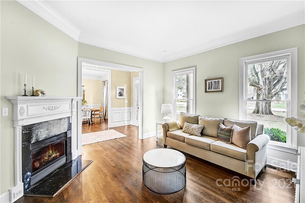 2826 Sharon Road Charlotte, NC 28211 - Photo 15 of 47 a living room with furniture and a fireplace