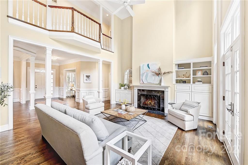2826 Sharon Road Charlotte, NC 28211 - Photo 21 of 47 a living room with furniture a fireplace and a large window