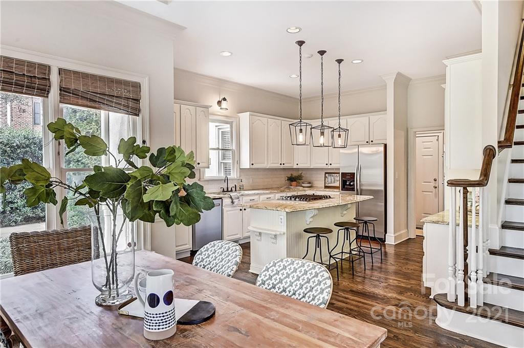 2826 Sharon Road Charlotte, NC 28211 - Photo 22 of 47 a kitchen with counter top space and wooden floor