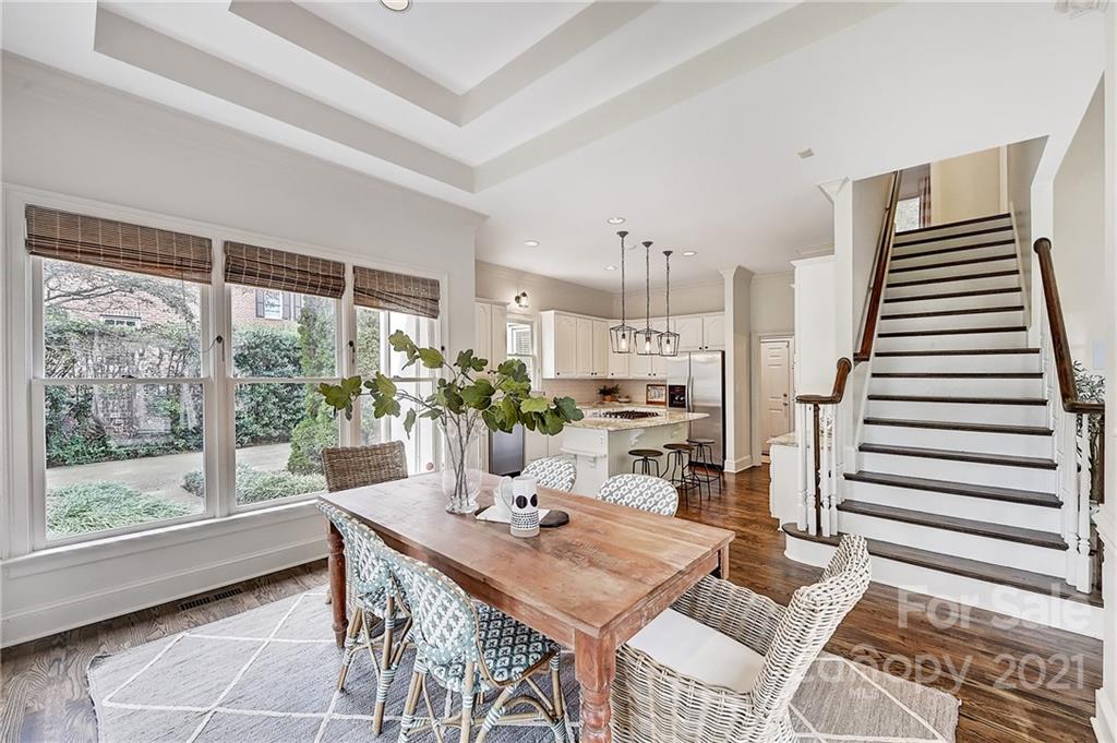 2826 Sharon Road Charlotte, NC 28211 - Photo 23 of 47 a view of a dining room with furniture window and wooden floor