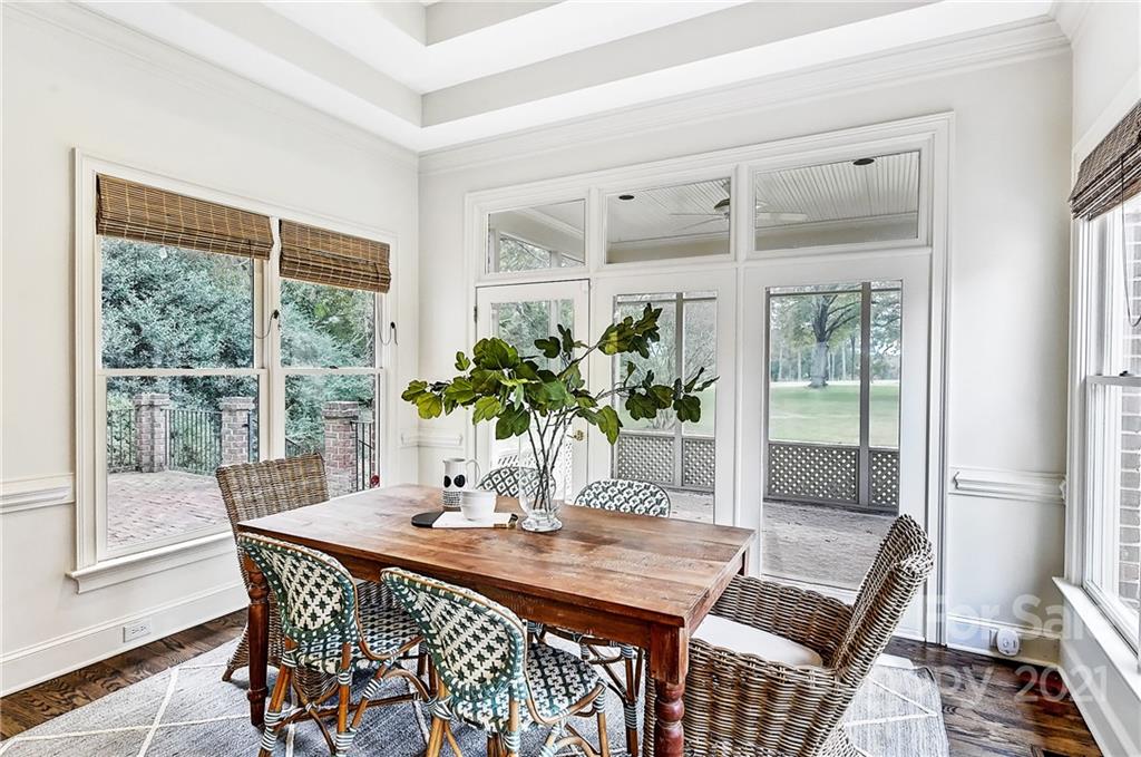 2826 Sharon Road Charlotte, NC 28211 - Photo 24 of 47 a dining room with furniture and wooden floor