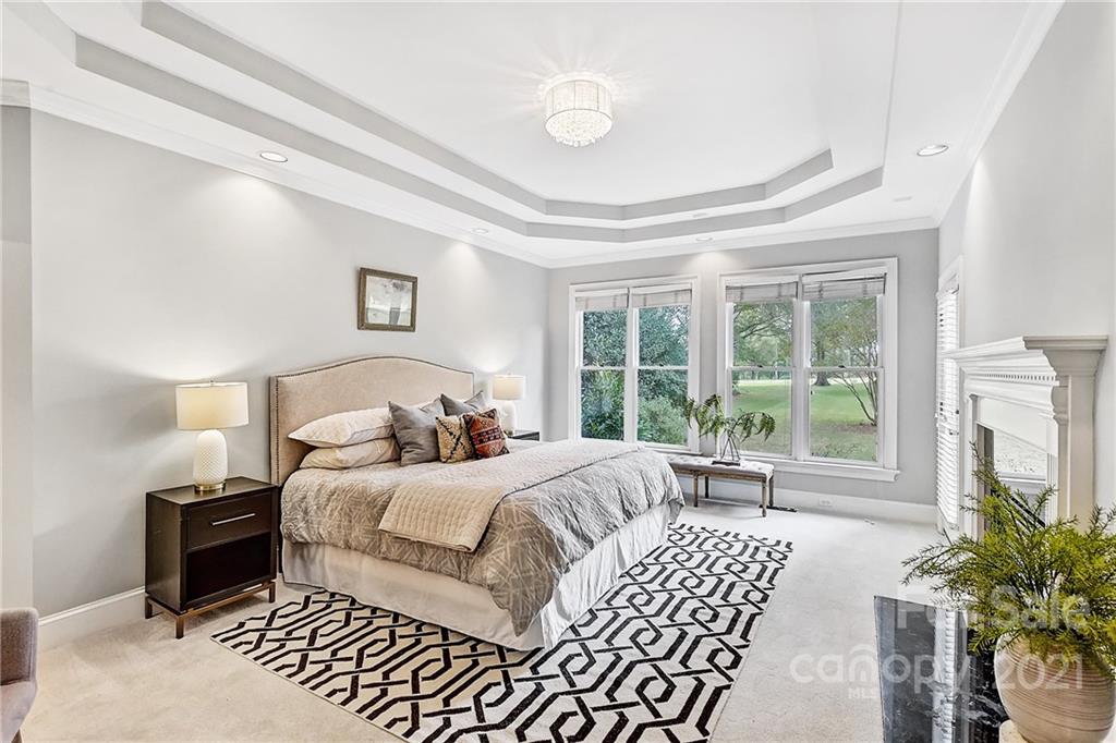 2826 Sharon Road Charlotte, NC 28211 - Photo 29 of 47 a bedroom with a bed and a large window