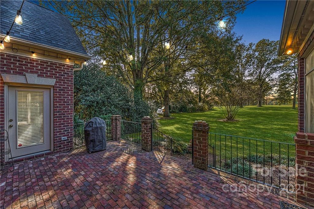 2826 Sharon Road Charlotte, NC 28211 - Photo 31 of 47 a backyard of a house with lots of green space