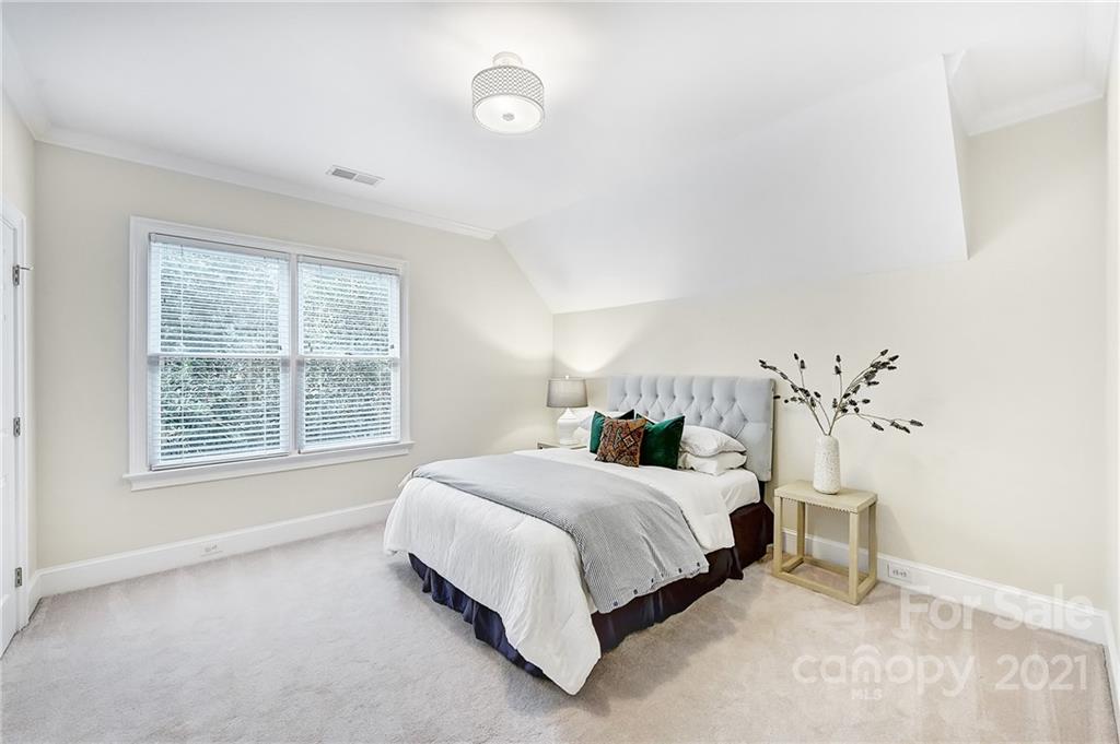 2826 Sharon Road Charlotte, NC 28211 - Photo 40 of 47 a bedroom with a large bed and a window