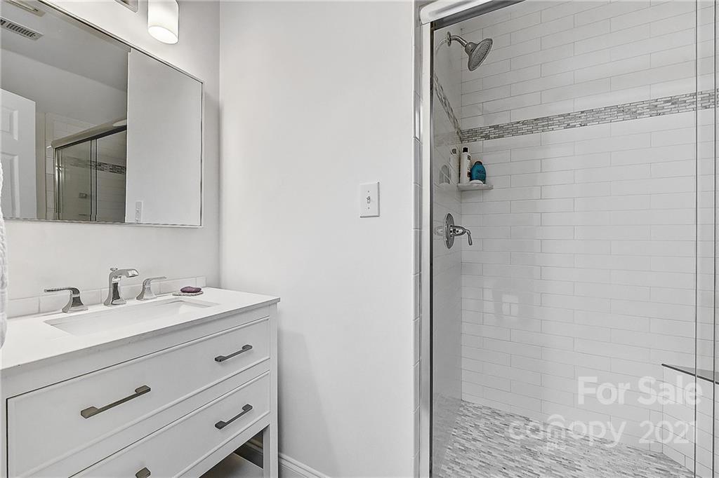 2826 Sharon Road Charlotte, NC 28211 - Photo 43 of 47 a bathroom with a sink and a mirror