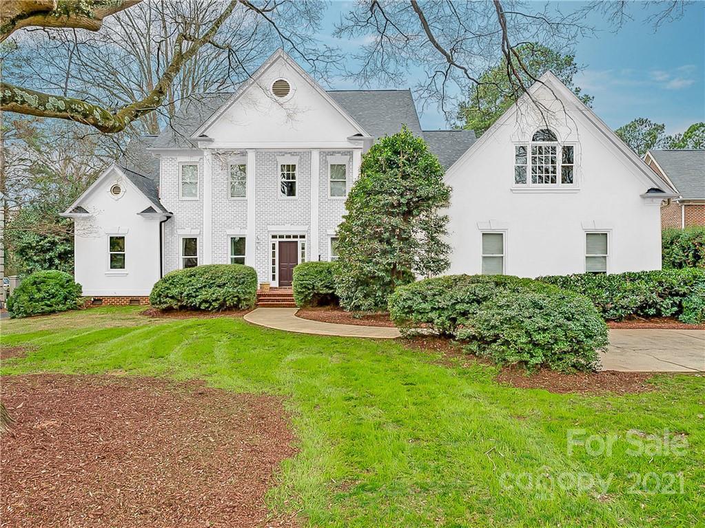 2826 Sharon Road Charlotte, NC 28211 - Photo 44 of 47 a front view of a house with a yard and trees
