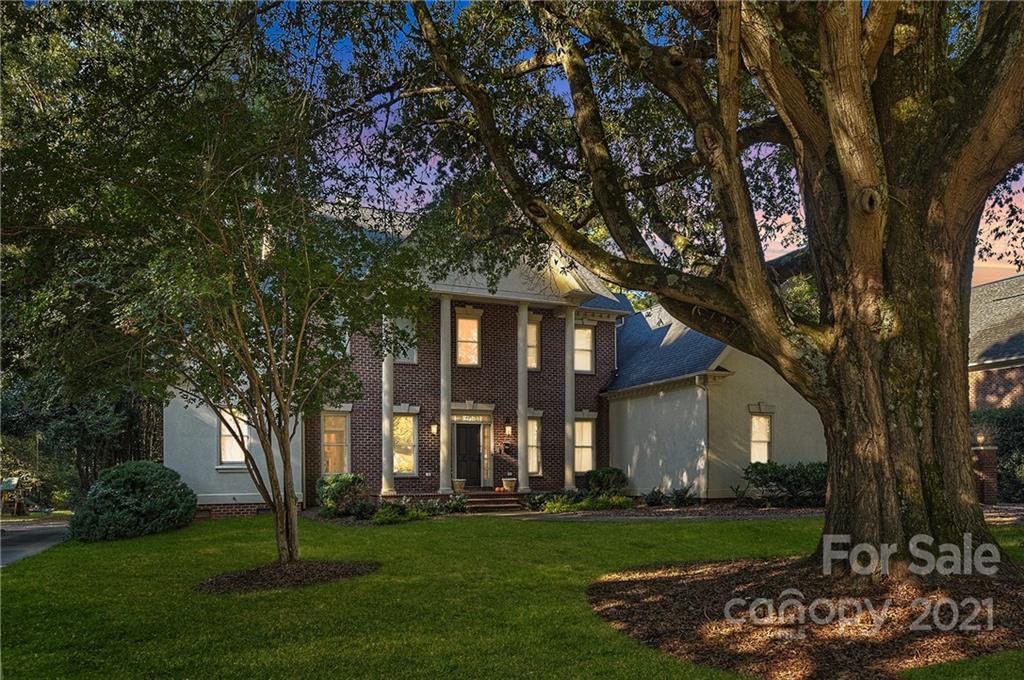 2826 Sharon Road Charlotte, NC 28211 - Photo 6 of 47 a front view of a house with a garden