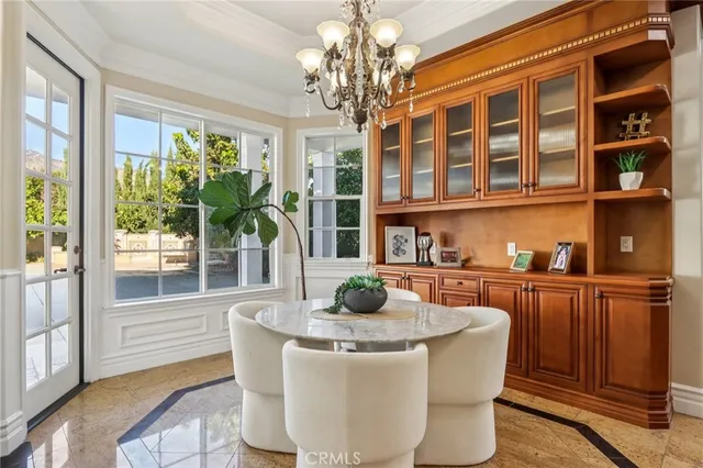 a kitchen with granite countertop wooden cabinets and stainless steel appliances