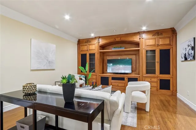 a dining room with furniture and wooden floor