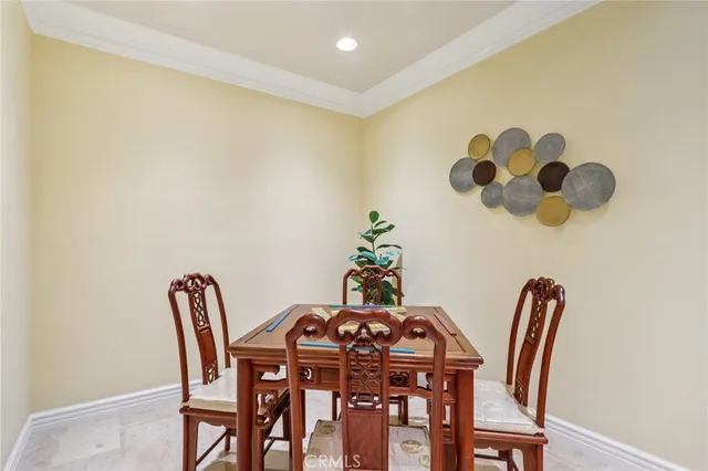 a view of a hallway with wooden floor and windows