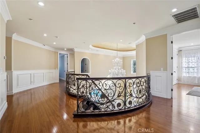 a bathroom with a granite countertop double vanity sink and a mirror