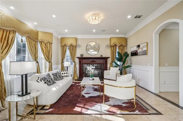 a view of a dining room with furniture and a chandelier