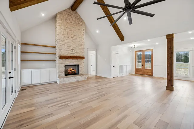 a large kitchen with a sink and large cabinets