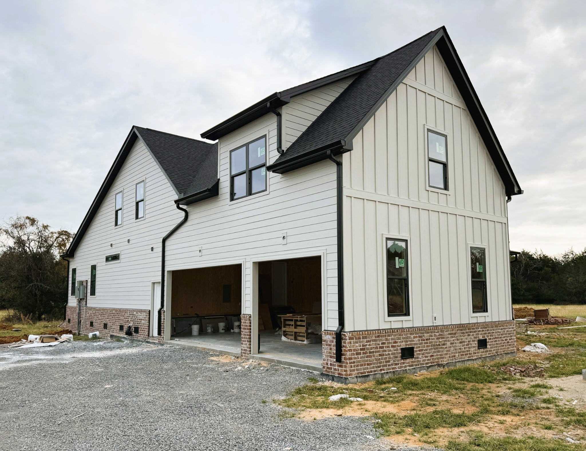 9665 McKee Road Lascassas, TN 37085 - Photo 2 of 15 a view of a white house with a large windows