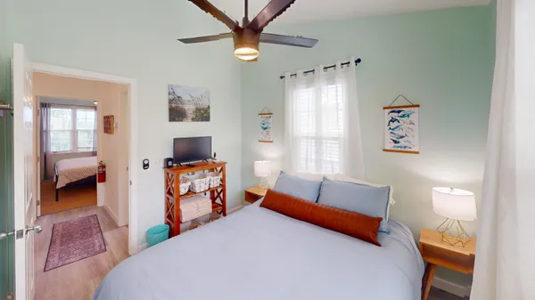 a bedroom with furniture and a chandelier