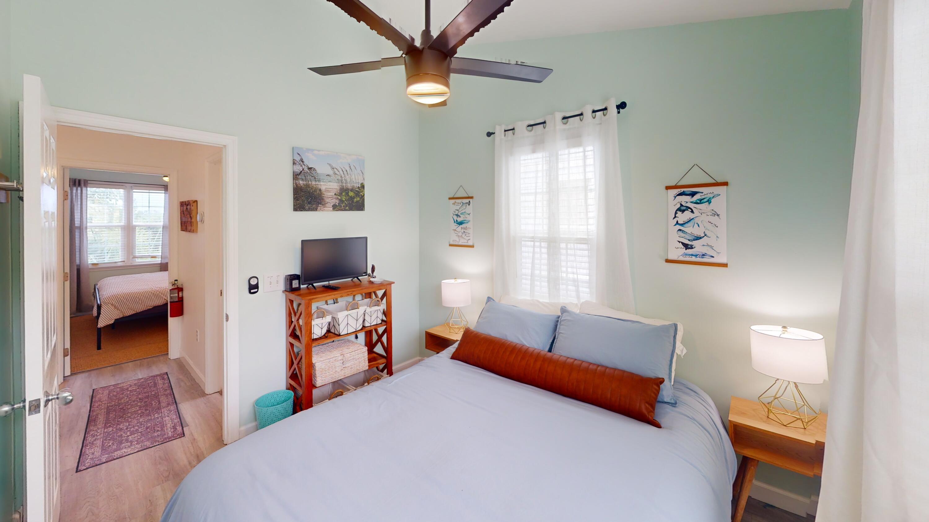 48 Merganser Lane Key West, FL 33040 - Photo 16 of 29 a bedroom with furniture and a chandelier