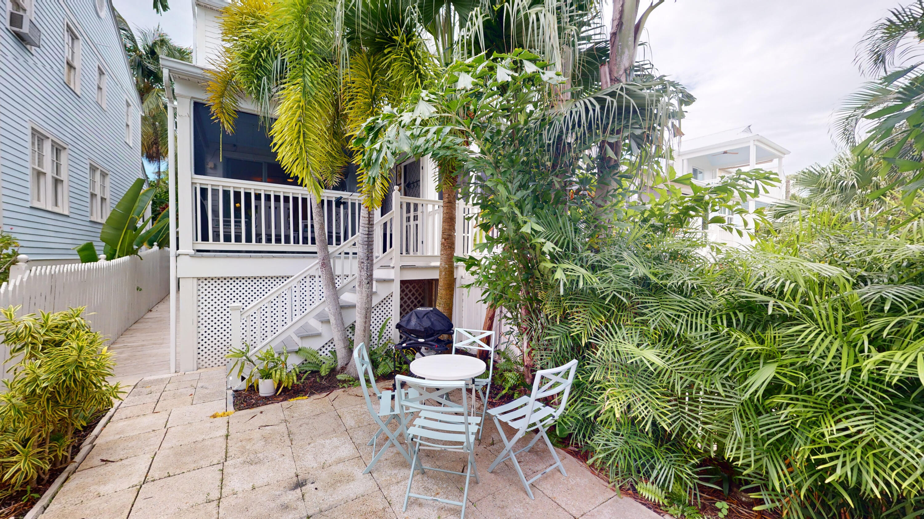 48 Merganser Lane Key West, FL 33040 - Photo 20 of 29 a view of a chair and table in backyard