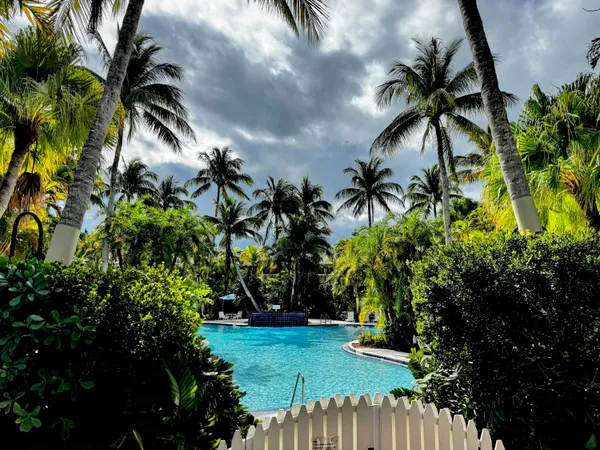 a view of swimming pool with outdoor seating