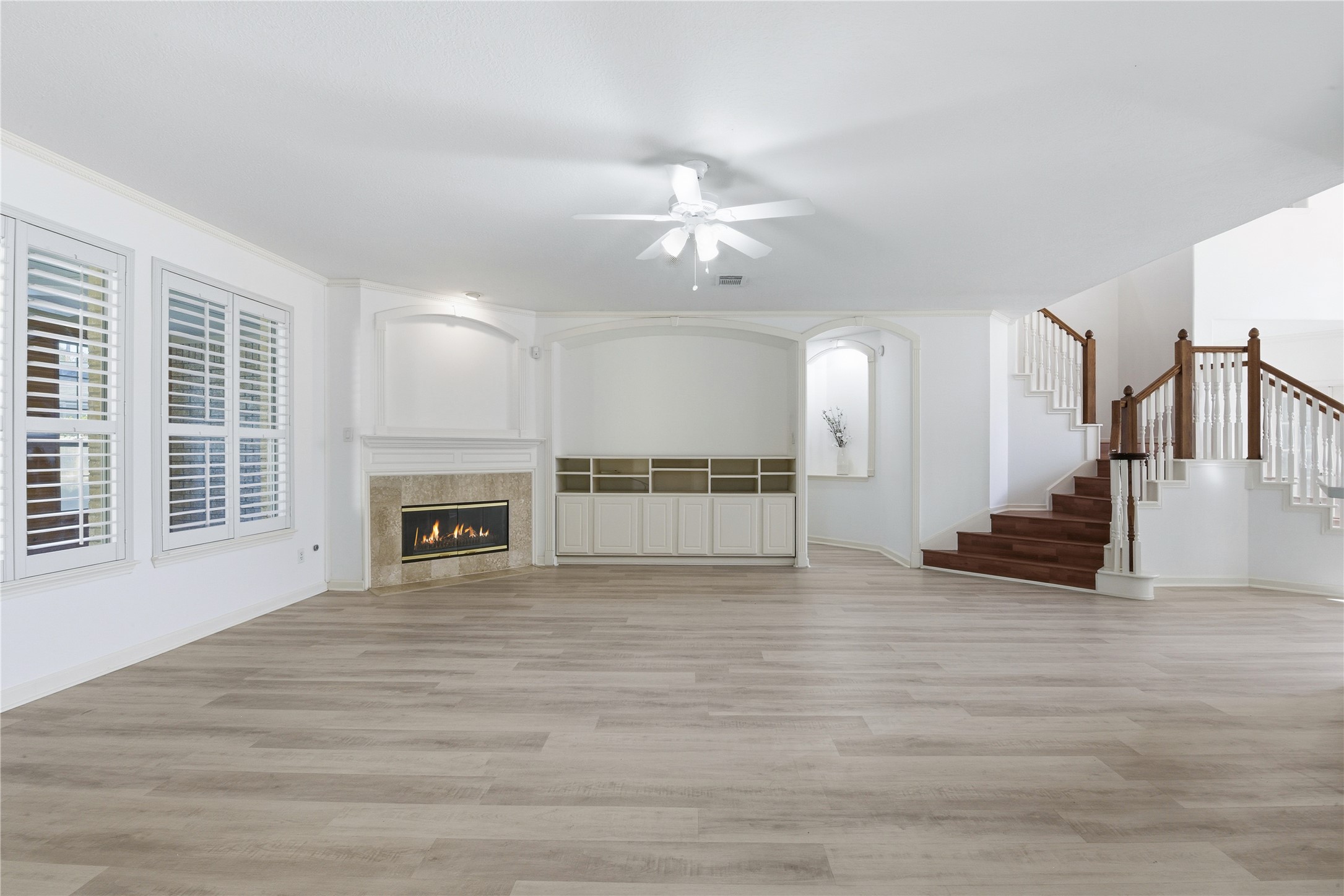 16614 Shorecrest Drive Houston, TX 77095 - Photo 13 of 50 a view of an empty room with a fireplace and a window