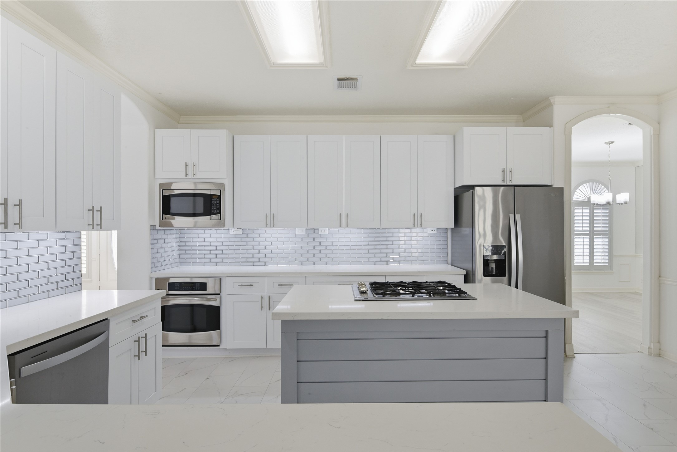 16614 Shorecrest Drive Houston, TX 77095 - Photo 15 of 50 a kitchen with granite countertop a stove cabinets and refrigerator