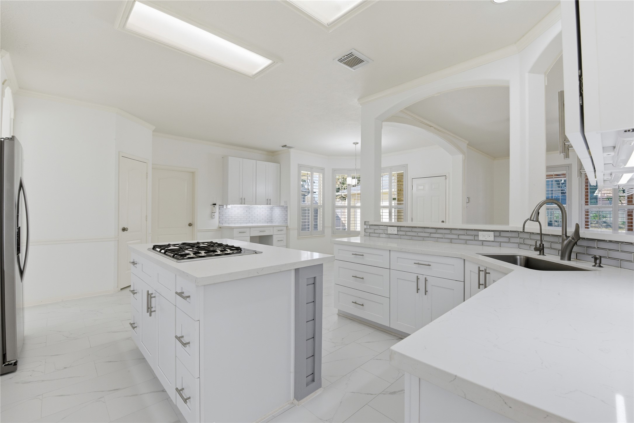 16614 Shorecrest Drive Houston, TX 77095 - Photo 17 of 50 a kitchen with granite countertop a sink stove and refrigerator