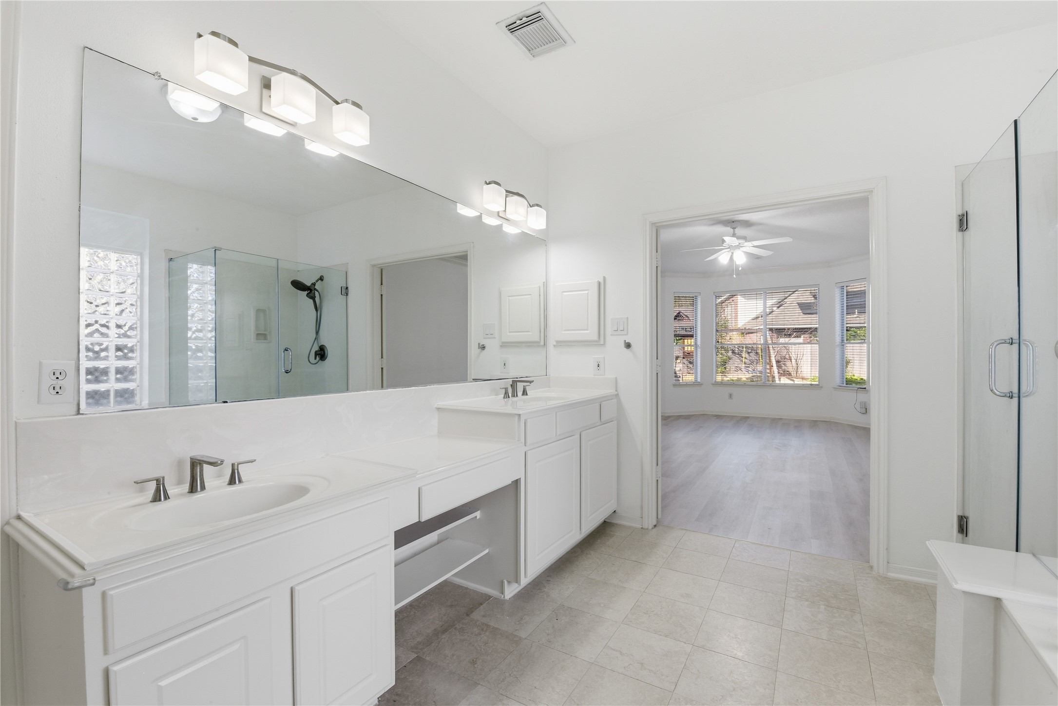 16614 Shorecrest Drive Houston, TX 77095 - Photo 24 of 50 a spacious bathroom with a double vanity sink and a mirror