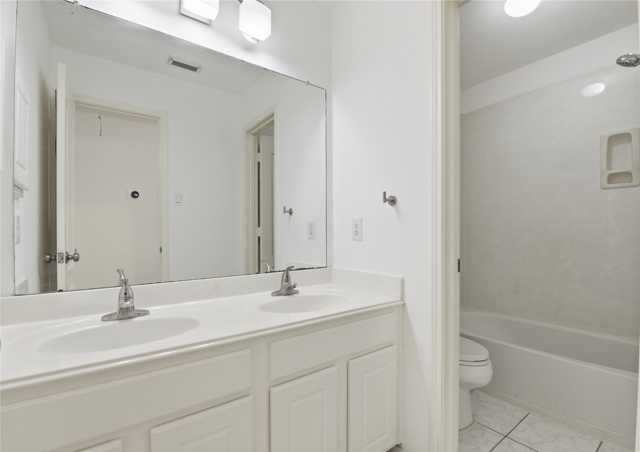 16614 Shorecrest Drive Houston, TX 77095 - Photo 30 of 50 a bathroom with a sink a toilet and a tub