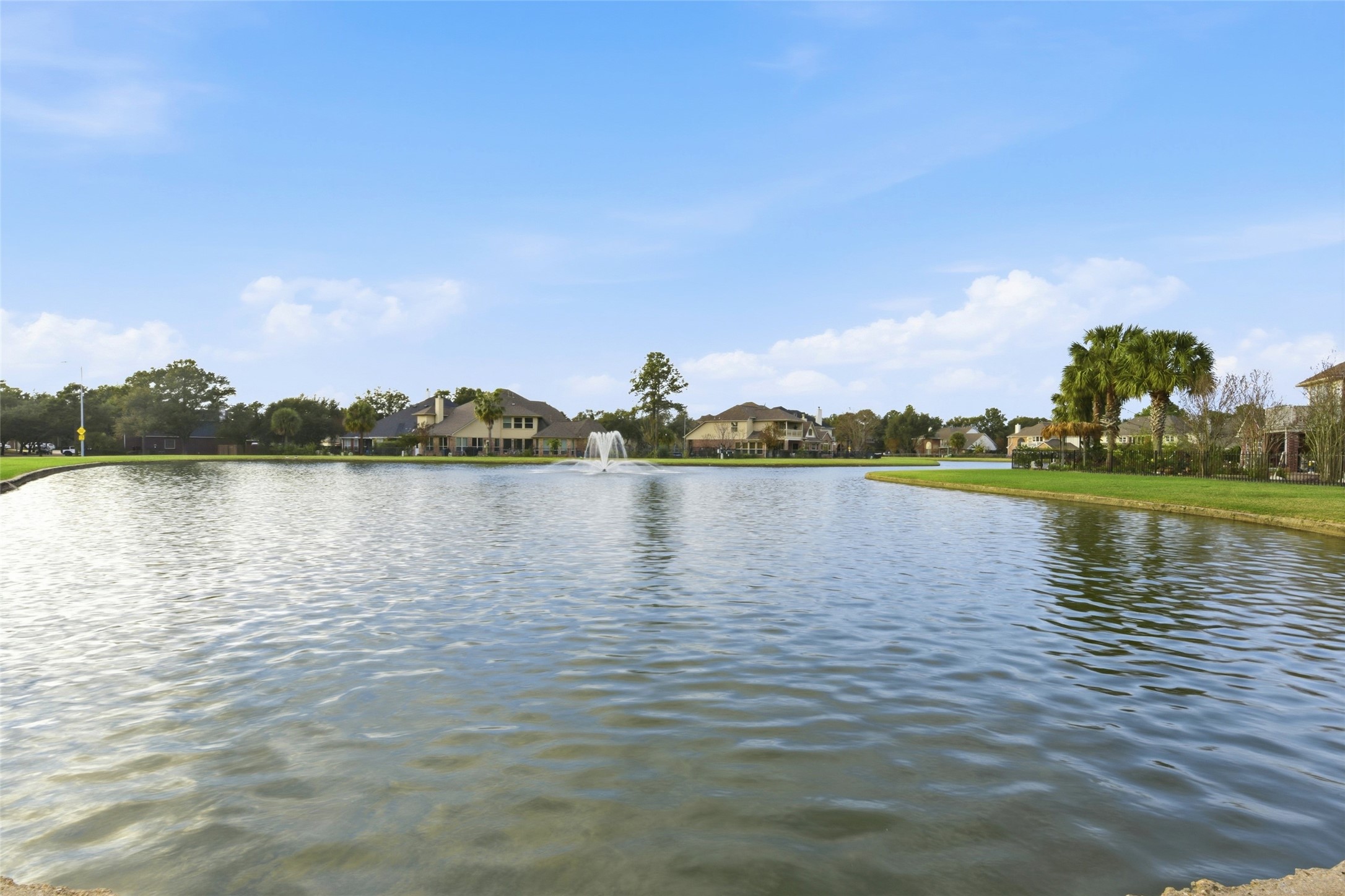 16614 Shorecrest Drive Houston, TX 77095 - Photo 46 of 50 a view of a lake with houses in the background