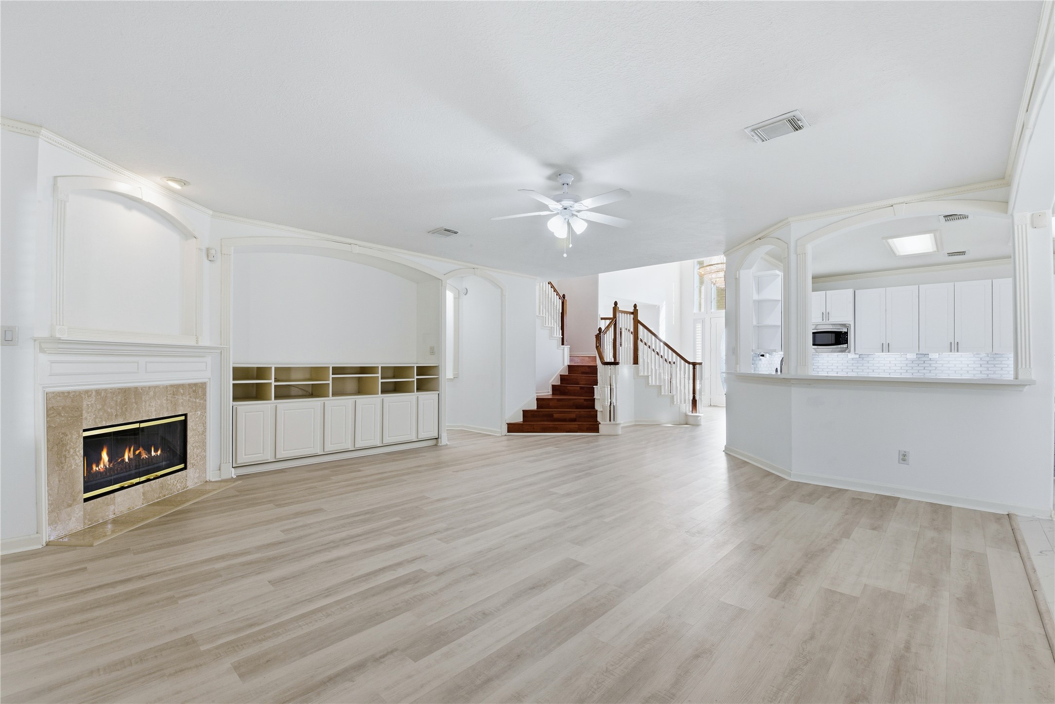 16614 Shorecrest Drive Houston, TX 77095 - Photo 9 of 50 a view of a kitchen with an empty space and a fireplace